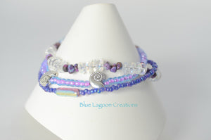 Three Strand Purple and Glass Shell Bracelet