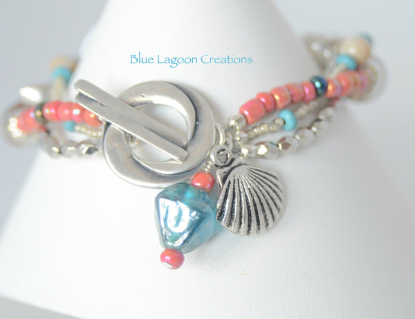 Three Strand Pink and Blue Bracelet with Lampwork Bead