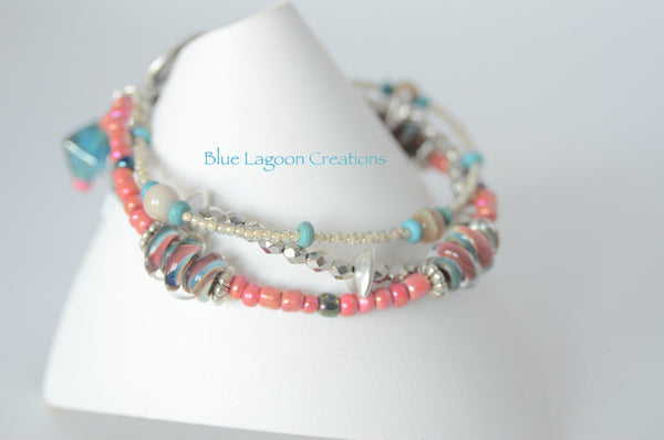 Three Strand Pink and Blue Bracelet with Lampwork Bead