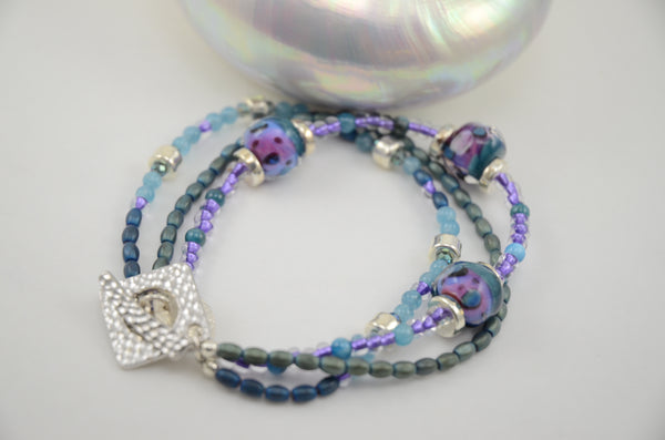 Three Strand Aqua and Purple Glass Bead Bracelet